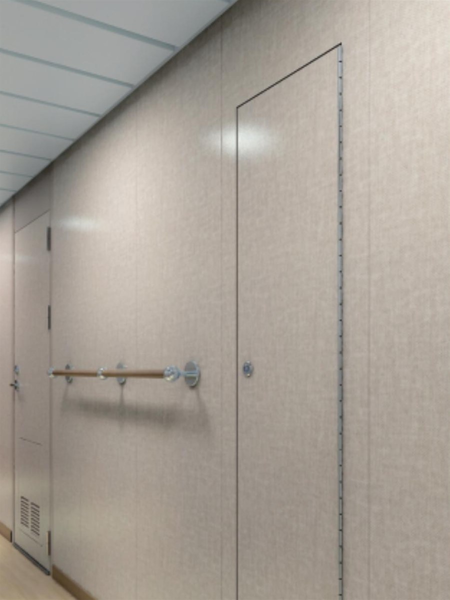 Accommodation corridor in composite wall panelling with a flush inspection door