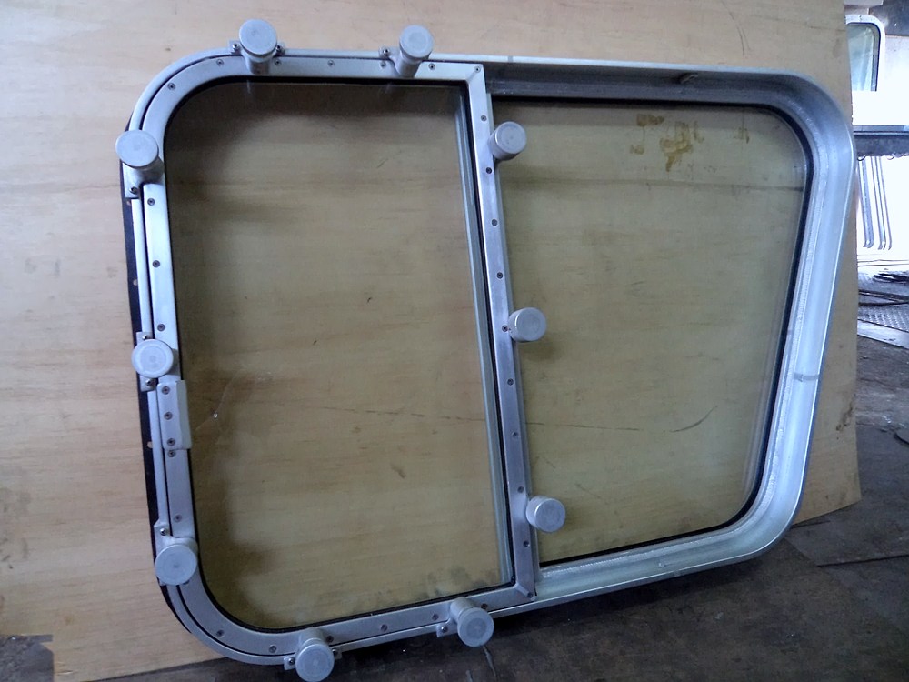 Hinged marine window, frame and glazed pane