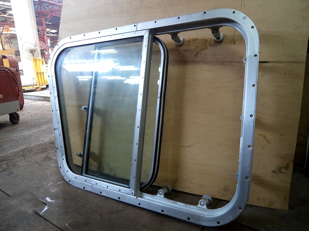 Sliding marine window